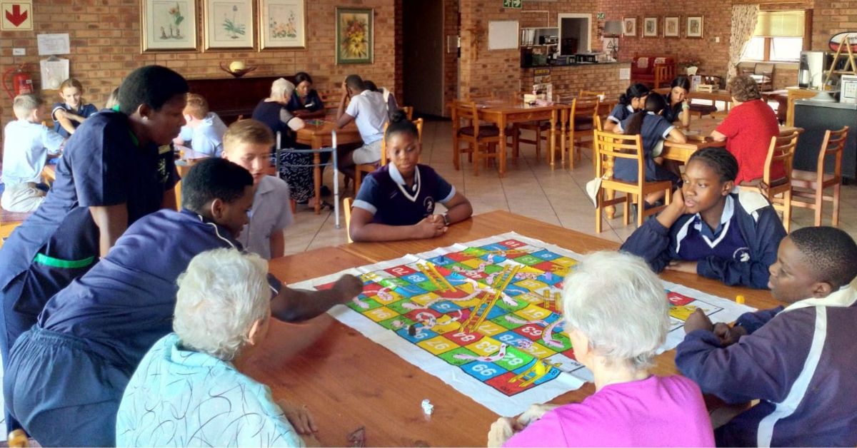 Young And Old Play Together At MacCare In Tzaneen, Limpopo